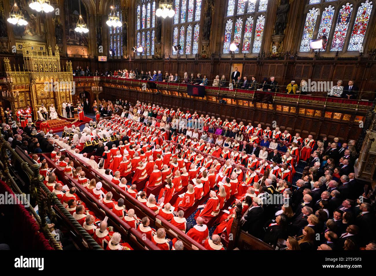 King Charles III delivers a speech beside Queen Camilla during the State Opening of Parliament