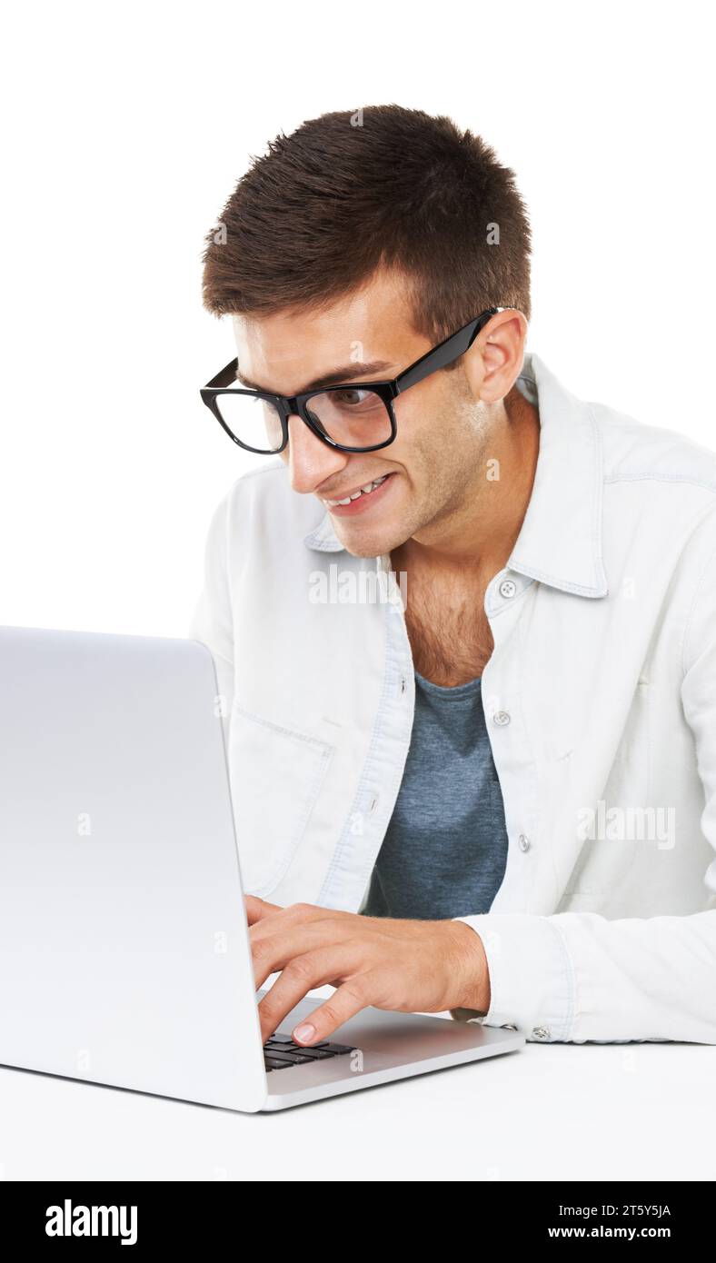 Geek, business man typing on laptop at desk or coding software isolated on a white background. Happy nerd in glasses on computer at table, technology Stock Photo