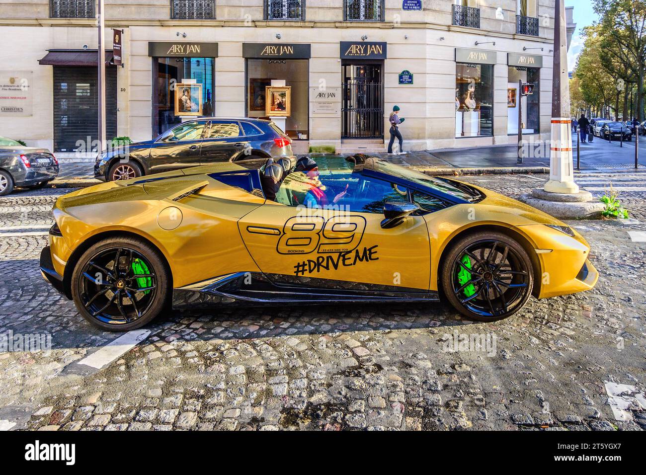Lamborghini Spyder self-drive hire car on a Parisian cobbled street