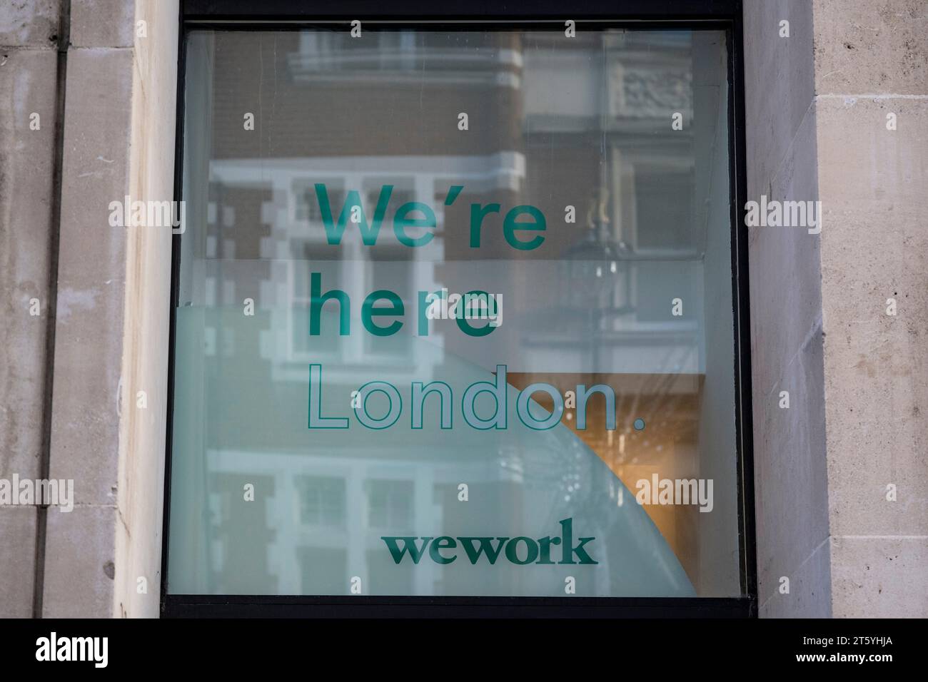 London, UK.  7 November 2023.   Signage on the exterior of the WeWork premises on Long Acre, Covent Garden.  WeWork has filed for bankruptcy in the US as it struggles to pay off billions of dollars of debt.  For now, locations outside the US and Canada are not part of the bankruptcy process and remain operational.  The office space sharing company was once valued at $47bn but a 98% decline in its share price this year values it at less than $50m.  Credit: Stephen Chung / Alamy Live News Stock Photo