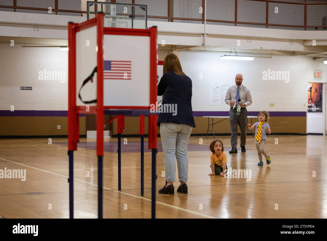 Louisville, USA. 07th Nov, 2023. A family attends a polling place and