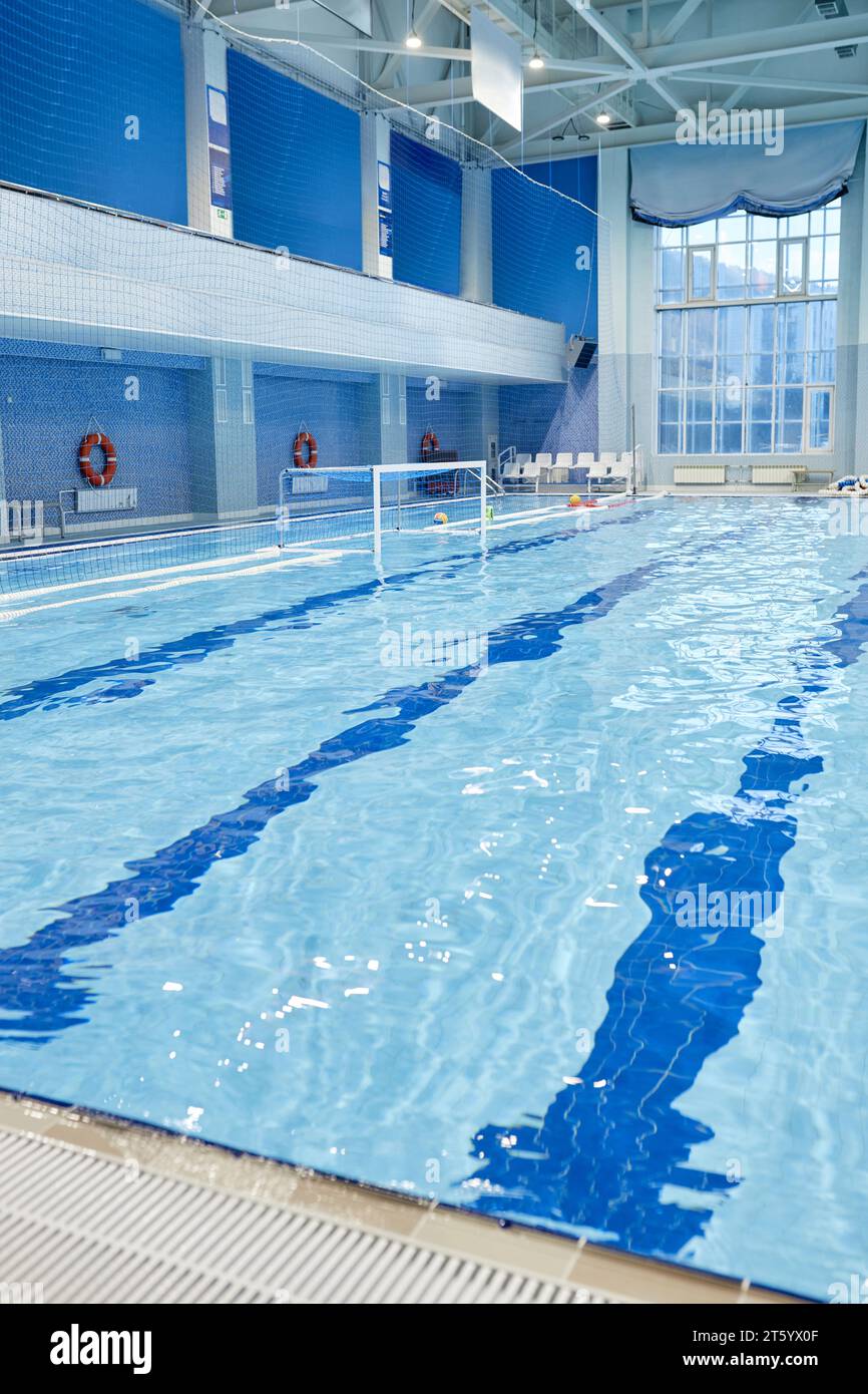 Part of long, deep and wide swimming pool with pure transparent blue ...