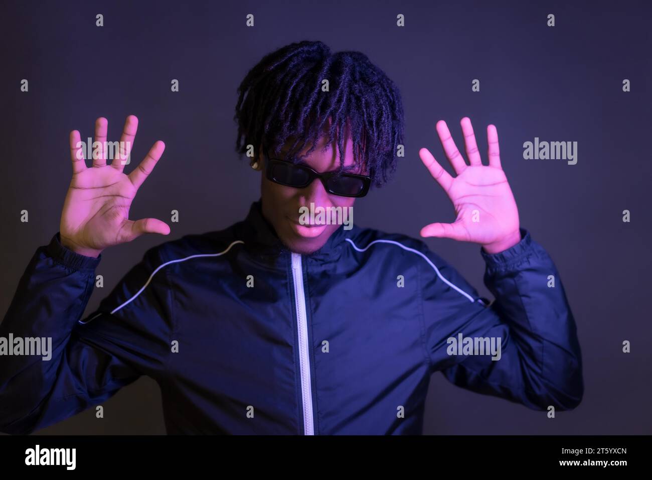 Dark studio portrait of a free style african musician posing Stock Photo