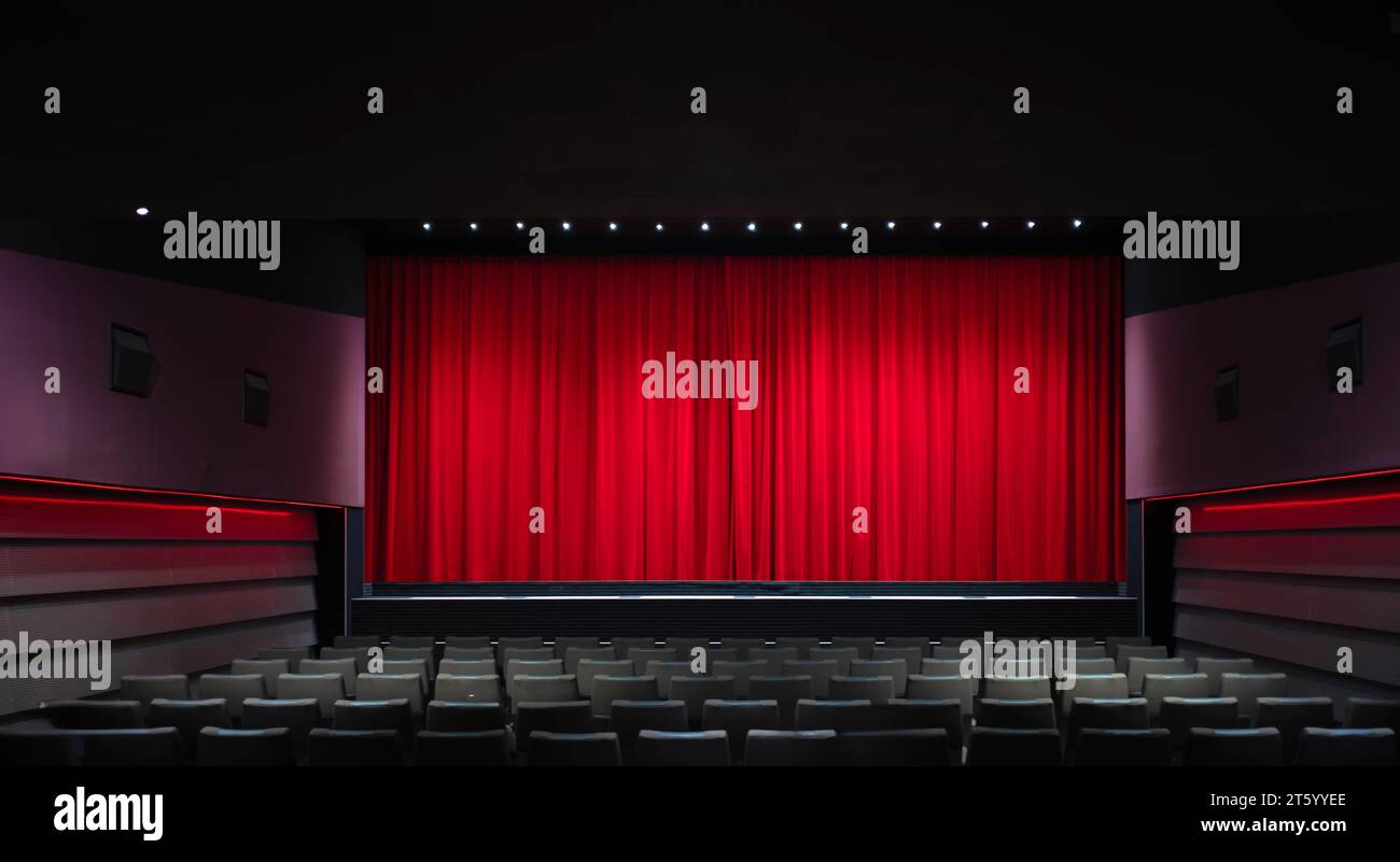 Interior shot, red velvet curtain in a cinema, theatre, rows of seats, Stuttgart, Baden-Wuerttemberg, Germany Stock Photo