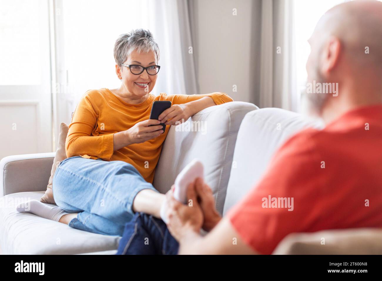 Senior woman resting feet hi-res stock photography and images - Alamy