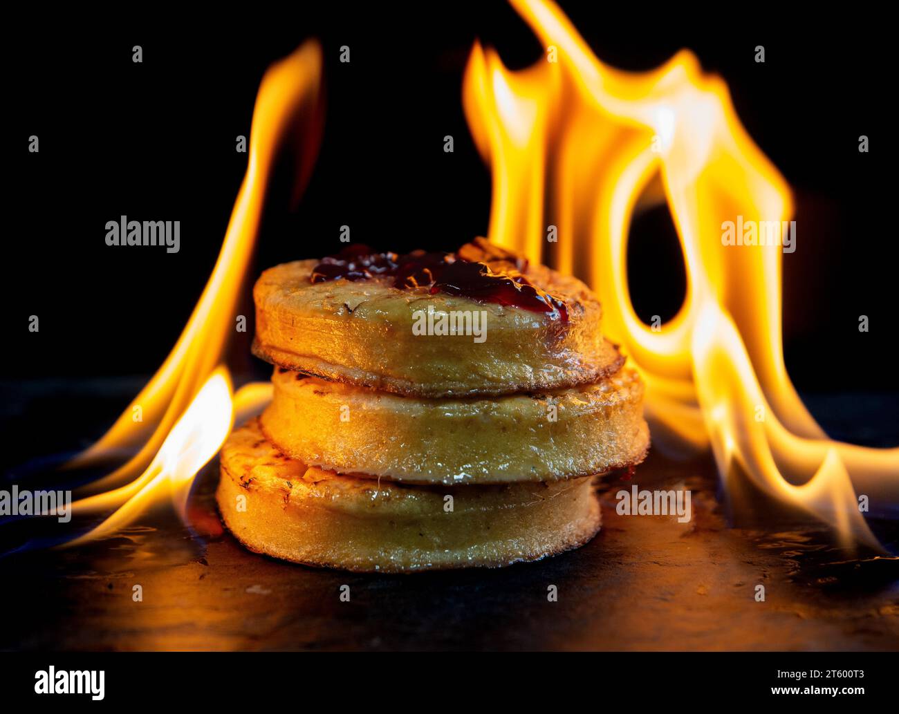 https://c8.alamy.com/comp/2T600T3/a-stack-of-crumpets-with-flames-around-the-outside-2T600T3.jpg