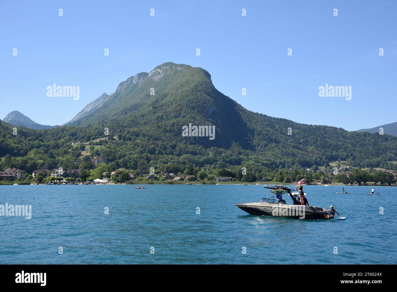 Electric Speed Boat or Pleasure Boat and Tourists on Annecy Lake or Lac d'Annecy Haute-Savoie France Stock Photo