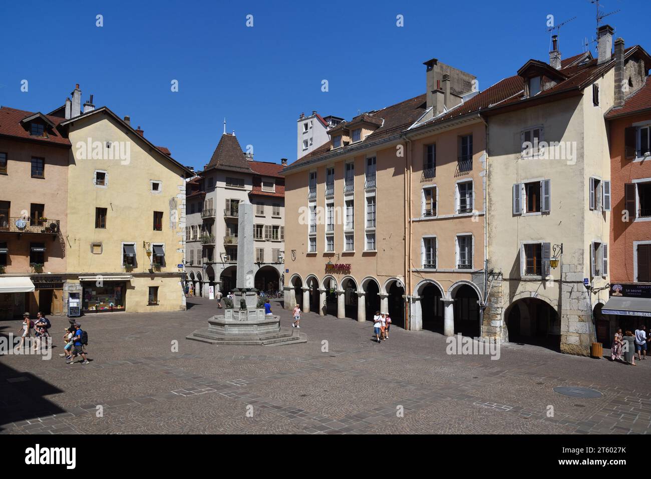 Place Notre-Dame or Town Square and Obelisk Street Fountain & Traditional Architecture in Old Town or Historic District of Annecy Haute-Savoie France Stock Photo