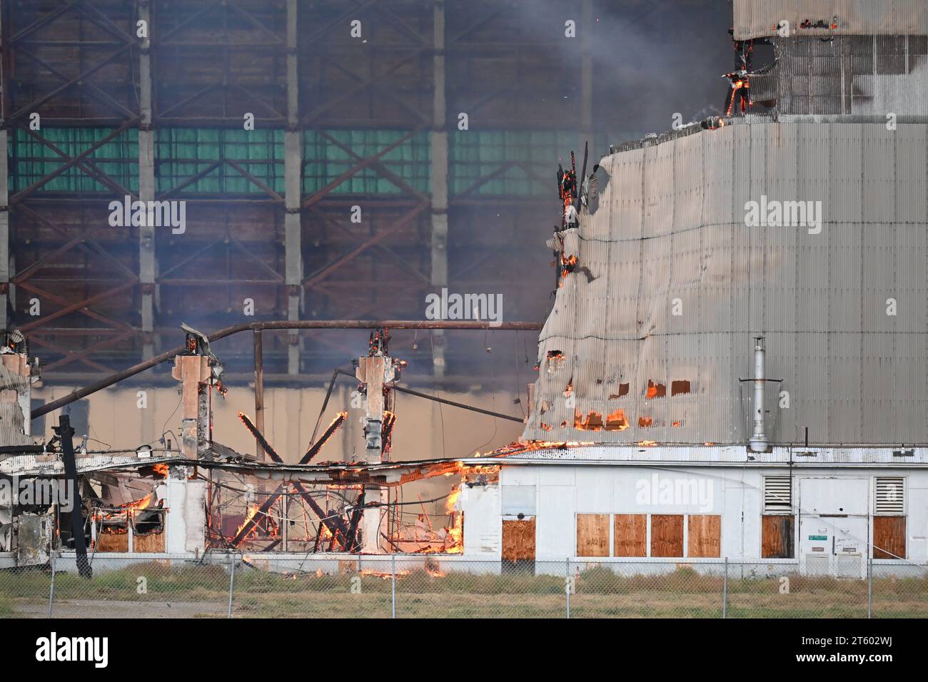 TUSTIN, CALIFORNIA - 7 NOV 2023: Closeup of the MCAS Tustin Blimp Hangar on fire. Stock Photo