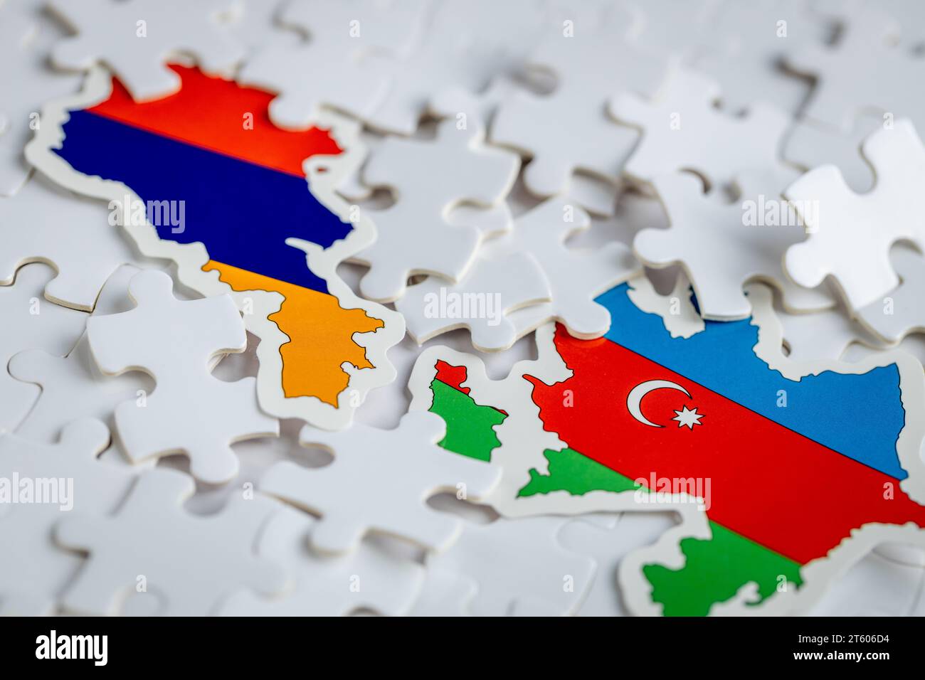 Flags of Armenia and Azerbaijan among scattered puzzle pieces, Concept, political puzzle, conflict between Armenia and Azerbaijan Stock Photo