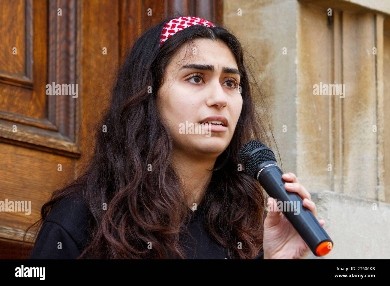 A Palestinian woman speaks to Pro-Palestinian supporters before a Gaza ceasefire protest march in Bath, UK. 4th Nov, 2023 Stock Photo