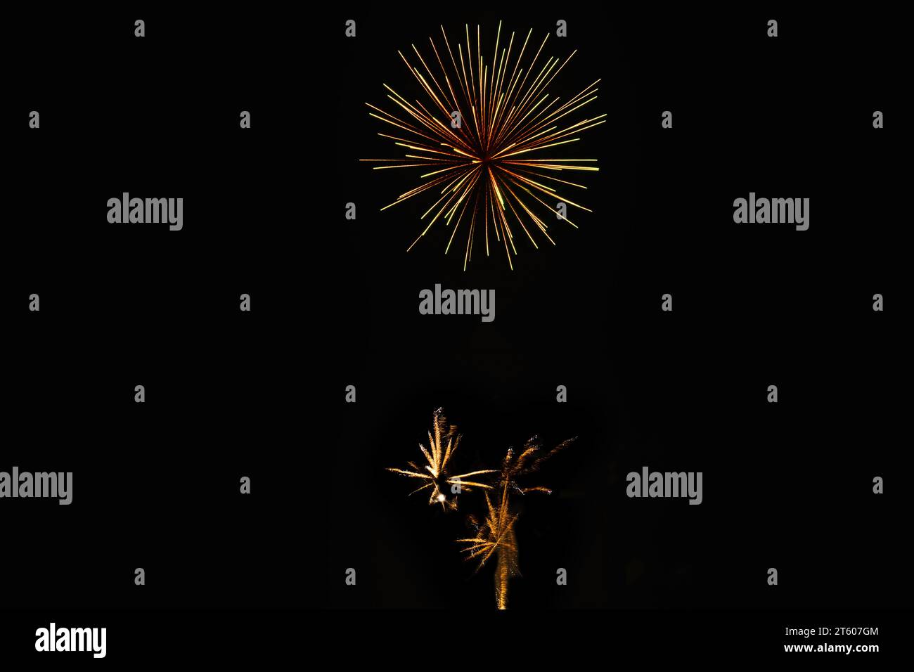 New Year's Night, Diwali, bonfire night Starbursts and Rocket Explosions on Black Background Sky with Red, Green, Blue, Purple, Gold Colour fireworks Stock Photo