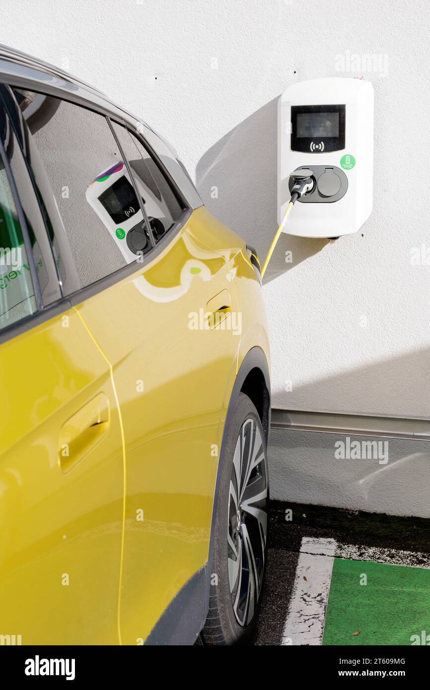 Electric car when charging at a public charging station Stock Photo Alamy