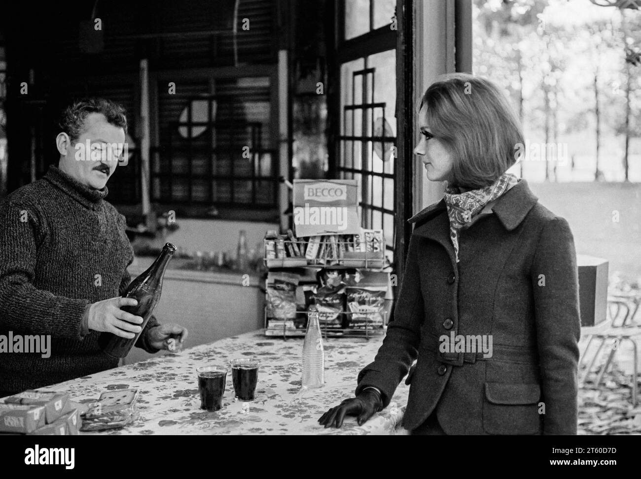 1960s, woman fashion model and kiosk manager serving wine, Jardin des Tuileries garden, Paris, France, Europe, Stock Photo