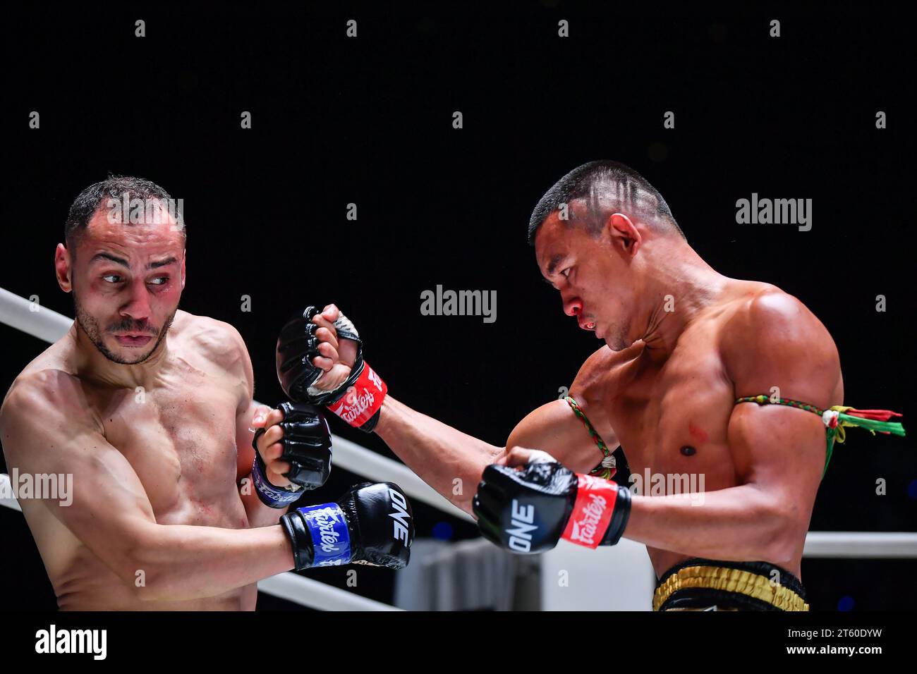 Saeksan Or. Kwanmuang (R) of Thailand and Karim Bennoui of French-Algerian seen in action during their match in ONE Fight Night 16 at Lumpinee Boxing Stadium. Stock Photo