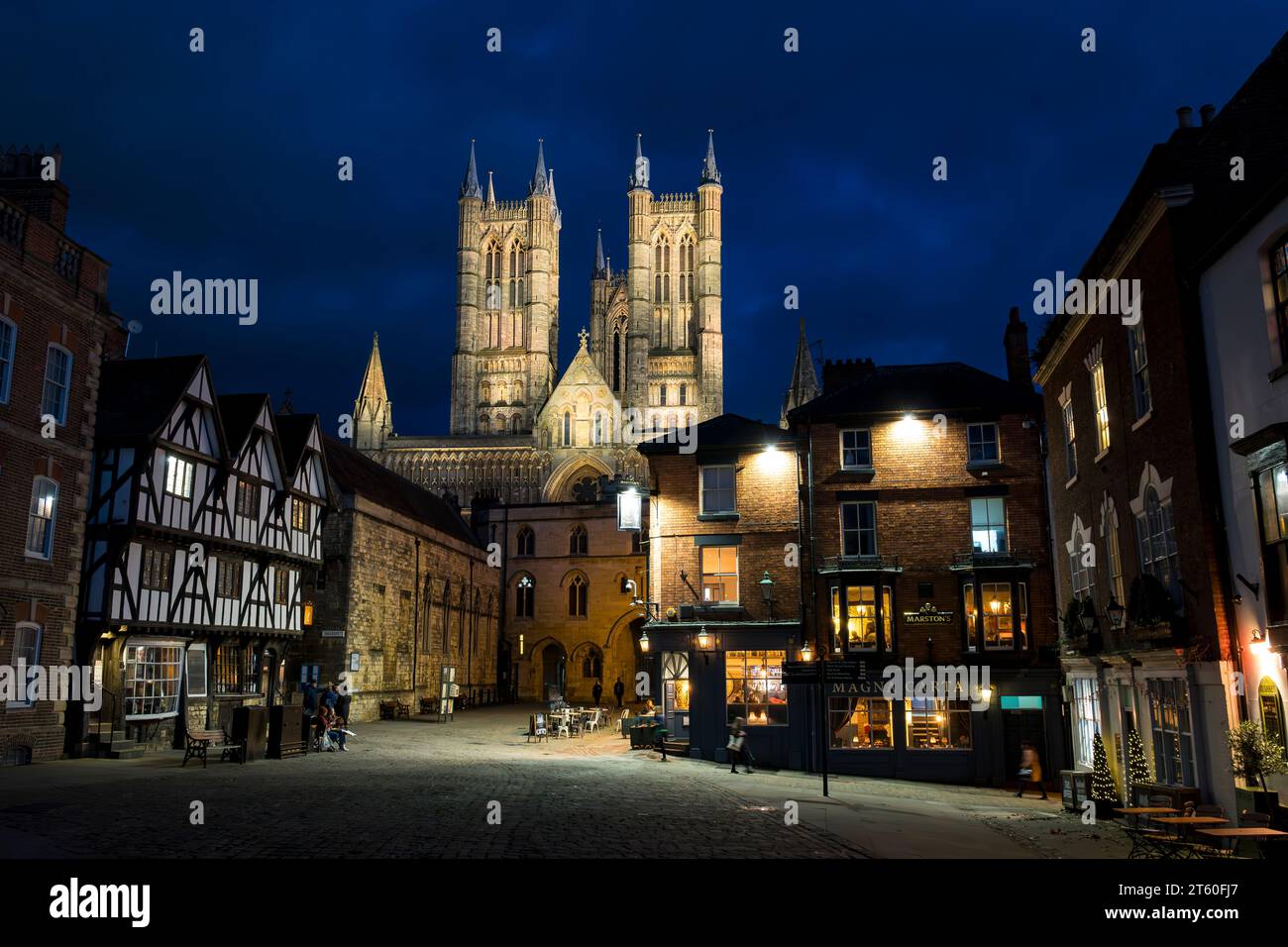 View along Castle Hill to Exchequer Gate and Lincoln Cathedral at night, Lincoln City, Lincolnshire, England, UK Stock Photo