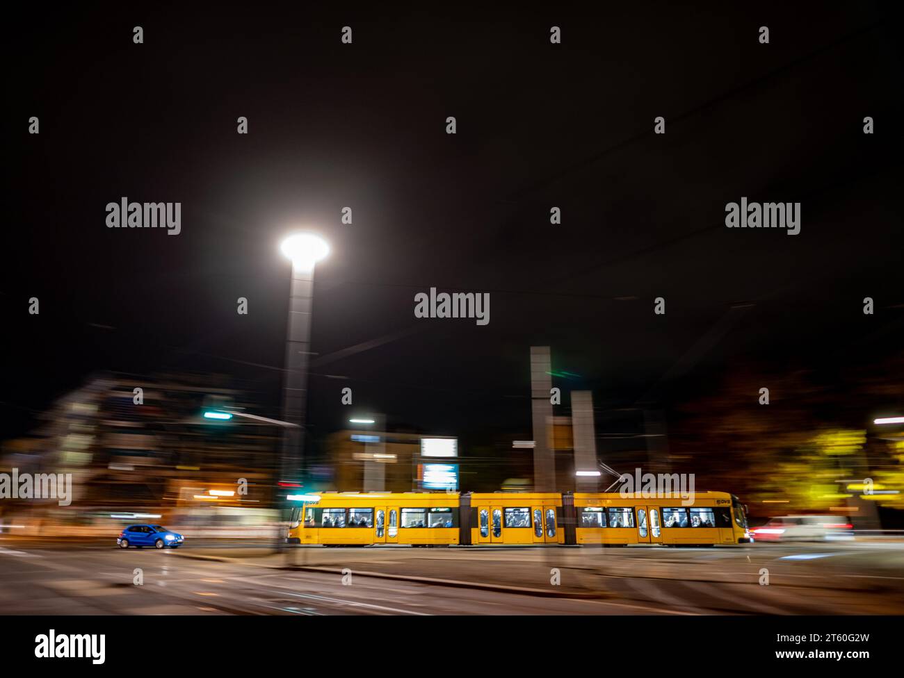 Dresden, Germany. 07th Nov, 2023. A streetcar of the Dresdner Verkehrsbetriebe (DVB) runs on line 12 through the Johannstadt district in the evening. (Shot with long exposure time) Credit: Robert Michael/dpa/Alamy Live News Stock Photo