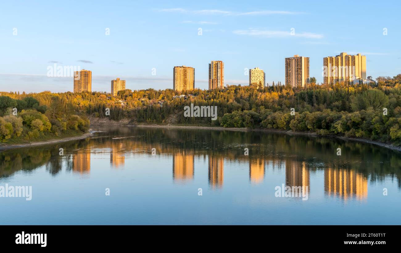 City of Edmonton river valley landcape with golden hour light and water reflection mix of blue and yellow colours Stock Photo