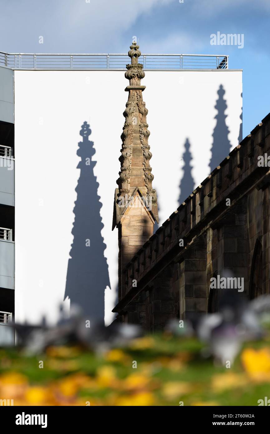 Pinnacle finials of St Andrews Cathedral with shadows on Q Park St ...