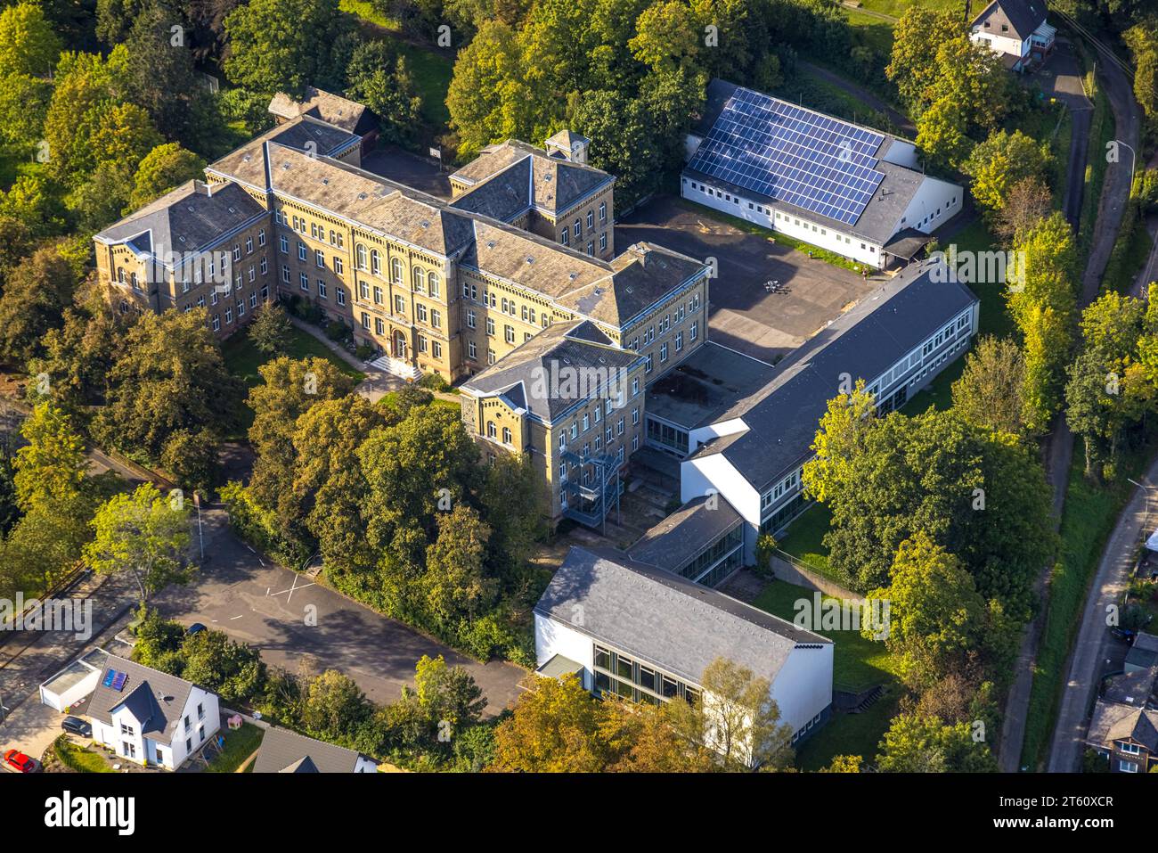 Carl kraemer realschule surrounded by green trees and hall with solar