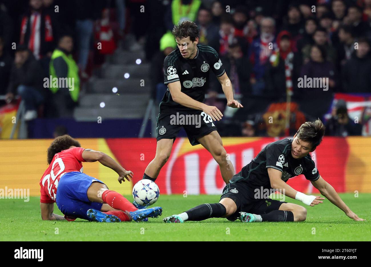 Celtic's Oh Hyeon-Gyu (right) and Atletico Madrid's Axel Witsel battle for the ball during the UEFA Champions League Group E match at the Estadio Metropolitano, Madrid. Picture date: Tuesday November 7, 2023. Stock Photo
