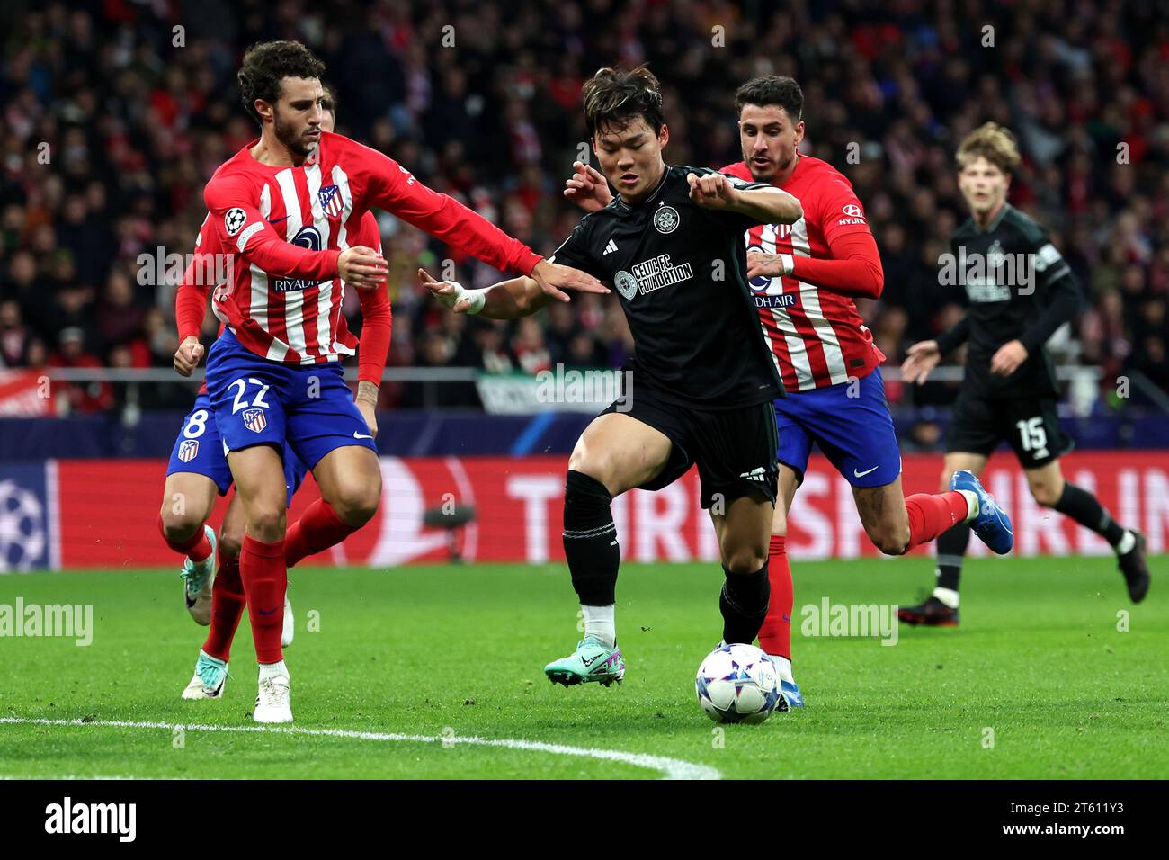 Celtic's Oh Hyeon-Gyu and Atletico Madrid's Mario Hermoso battle for the ball during the UEFA Champions League Group E match at the Estadio Metropolitano, Madrid. Picture date: Tuesday November 7, 2023. Stock Photo