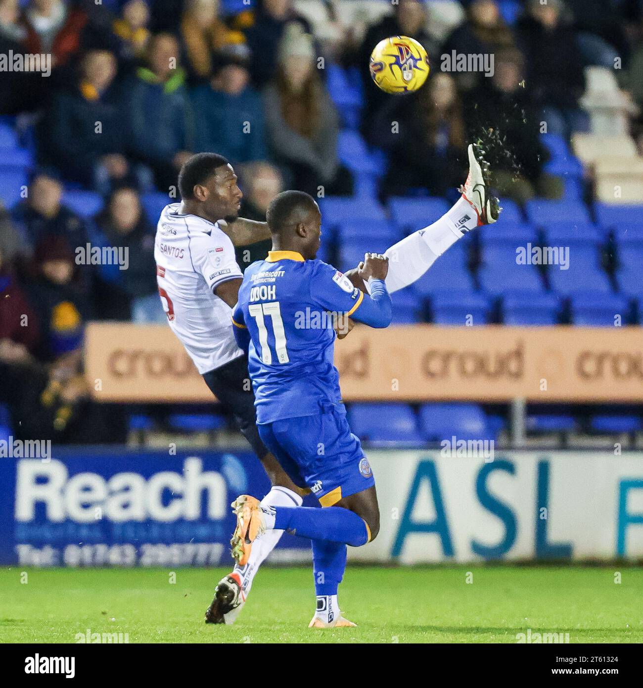 Shrewsbury, UK. 07th Nov, 2023. Bolton's captain, Ricardo Almeida Santos clears the ball over his head as Shrewsbury's Daniel Udoh presses him taken during the EFL Sky Bet League 1 match between Shrewsbury Town and Bolton Wanderers at Croud Meadow, Shrewsbury, England on 7 November 2023. Photo by Stuart Leggett. Editorial use only, license required for commercial use. No use in betting, games or a single club/league/player publications. Credit: UK Sports Pics Ltd/Alamy Live News Stock Photo