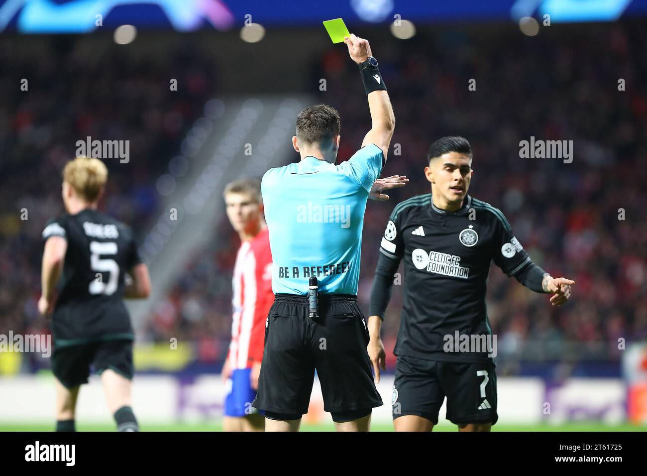 Madrid, Spain. 07th Nov, 2023. Referee gives a yellow card to Luis Palma during Champions League Match Day 4 between Atletico de Madrid and Celtic Glasgow at Civitas Metropolitano Stadium in Madrid, Spain, on November 7, 2023. Credit: Edward F. Peters/Alamy Live News Stock Photo