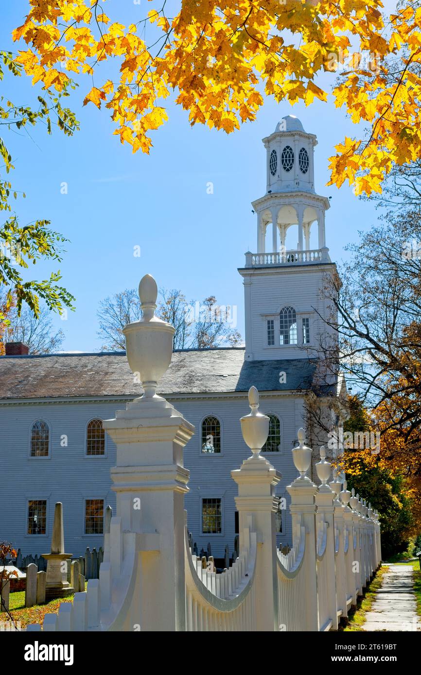 1806 Old First Congregational church in Bennington Vermont framed in brightly lit fall leaf colors Stock Photo