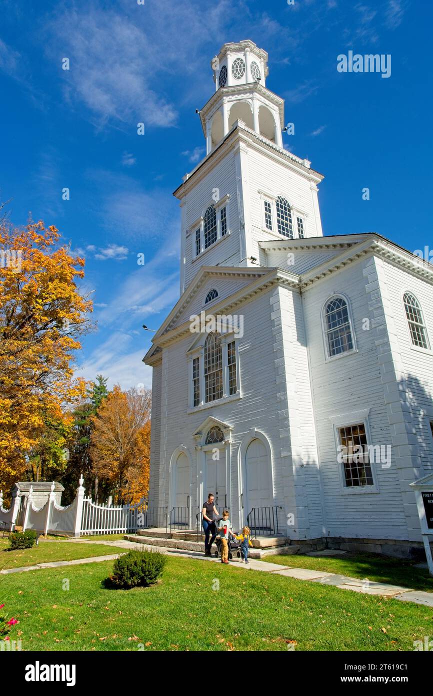 1806 Old First Congregational church in Bennington Vermont under blue sky brightly lit fall leaf colors Stock Photo