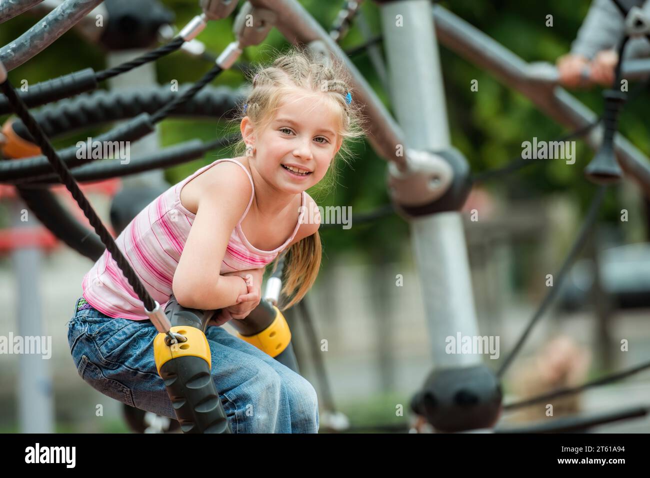 Happy cute smiling little girl playing at the playground outdoor Stock ...