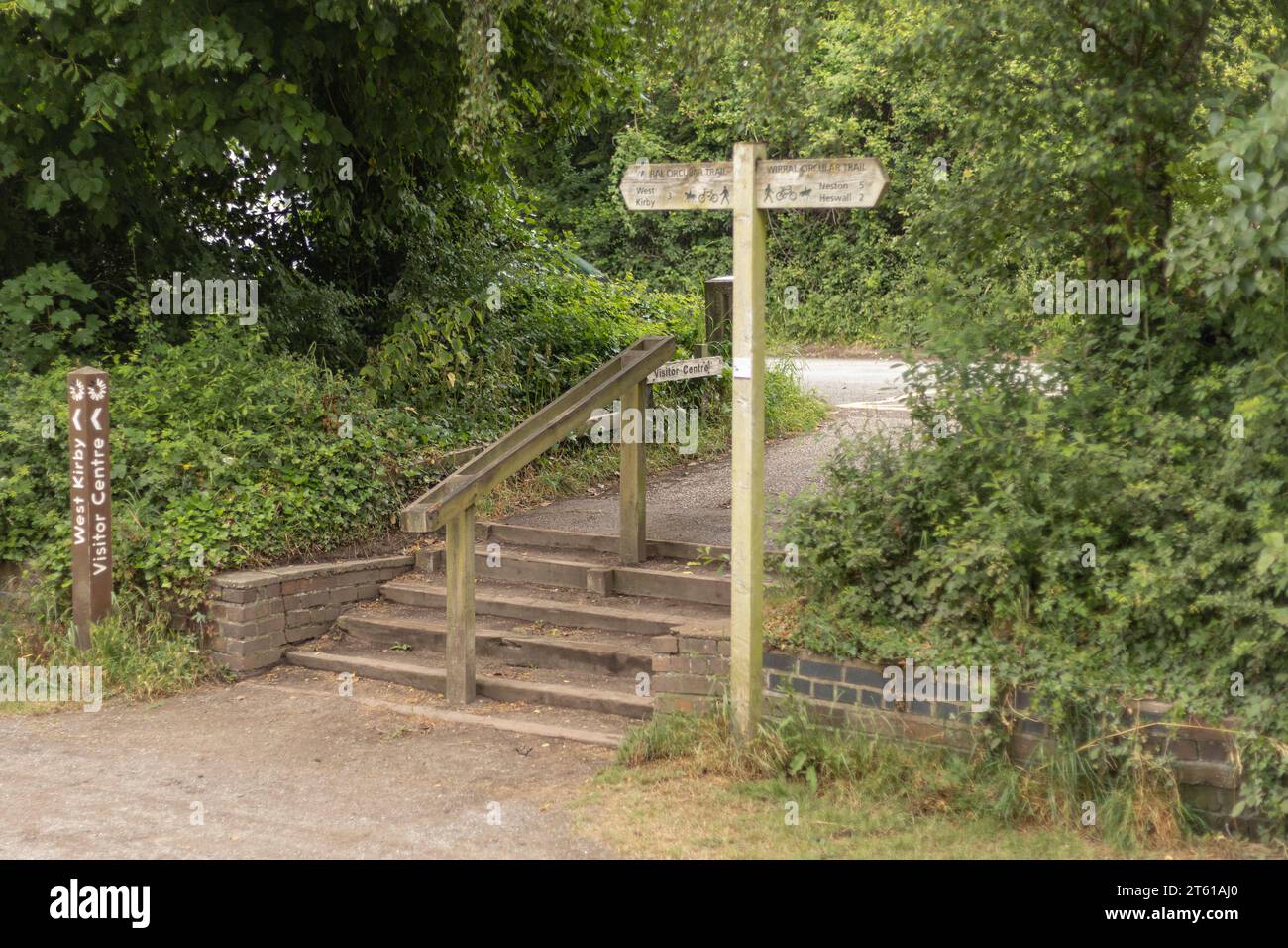 Wirral, Merseyside,  UK - Sign post and wooden steps on the wirral way a national park Stock Photo