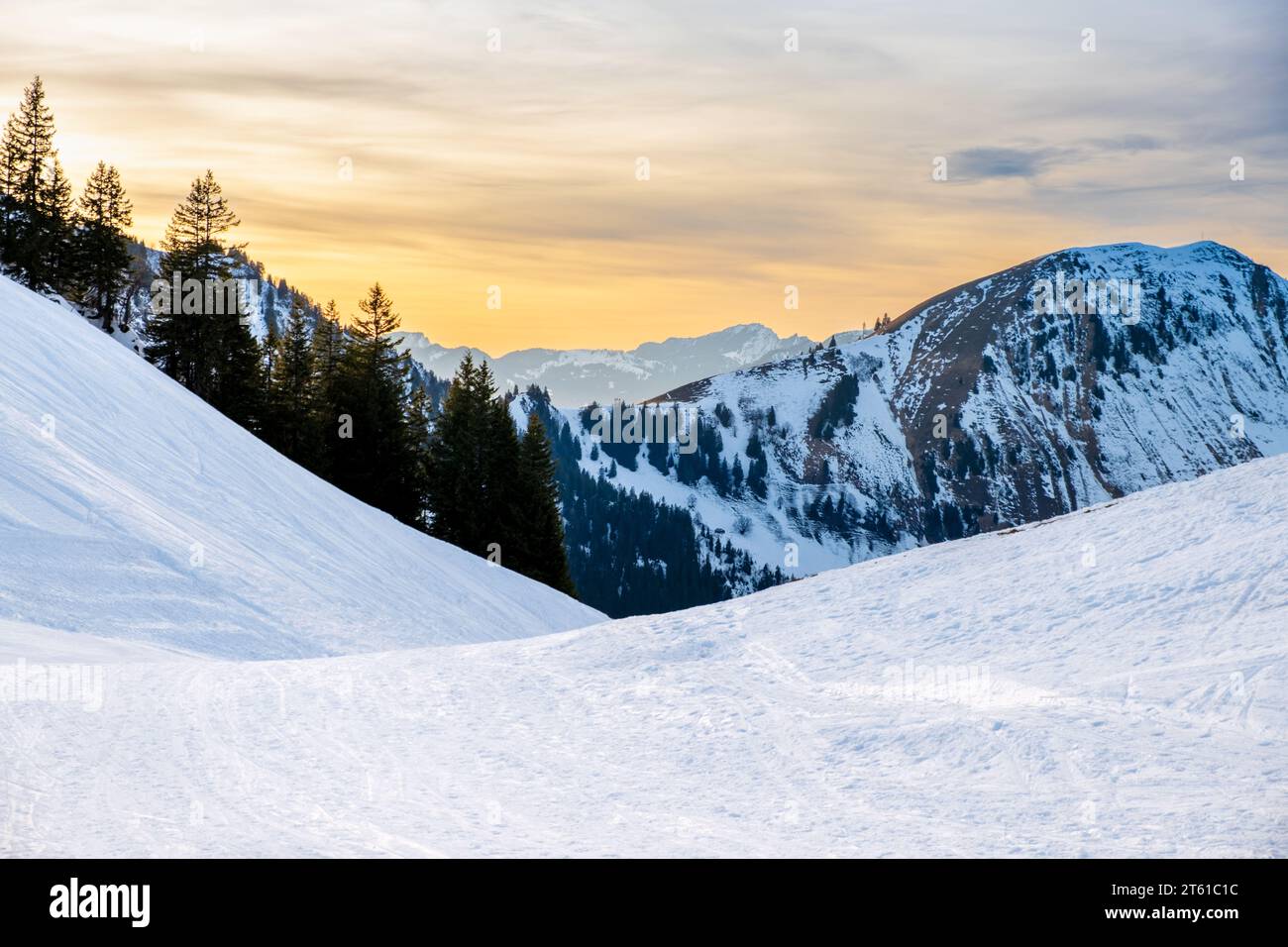 Winter landscape on Klewenalp mountain in Swiss Alps, Switzerland at sunset. Popular ski slope and winter sport attraction with snowy mountains and Stock Photo