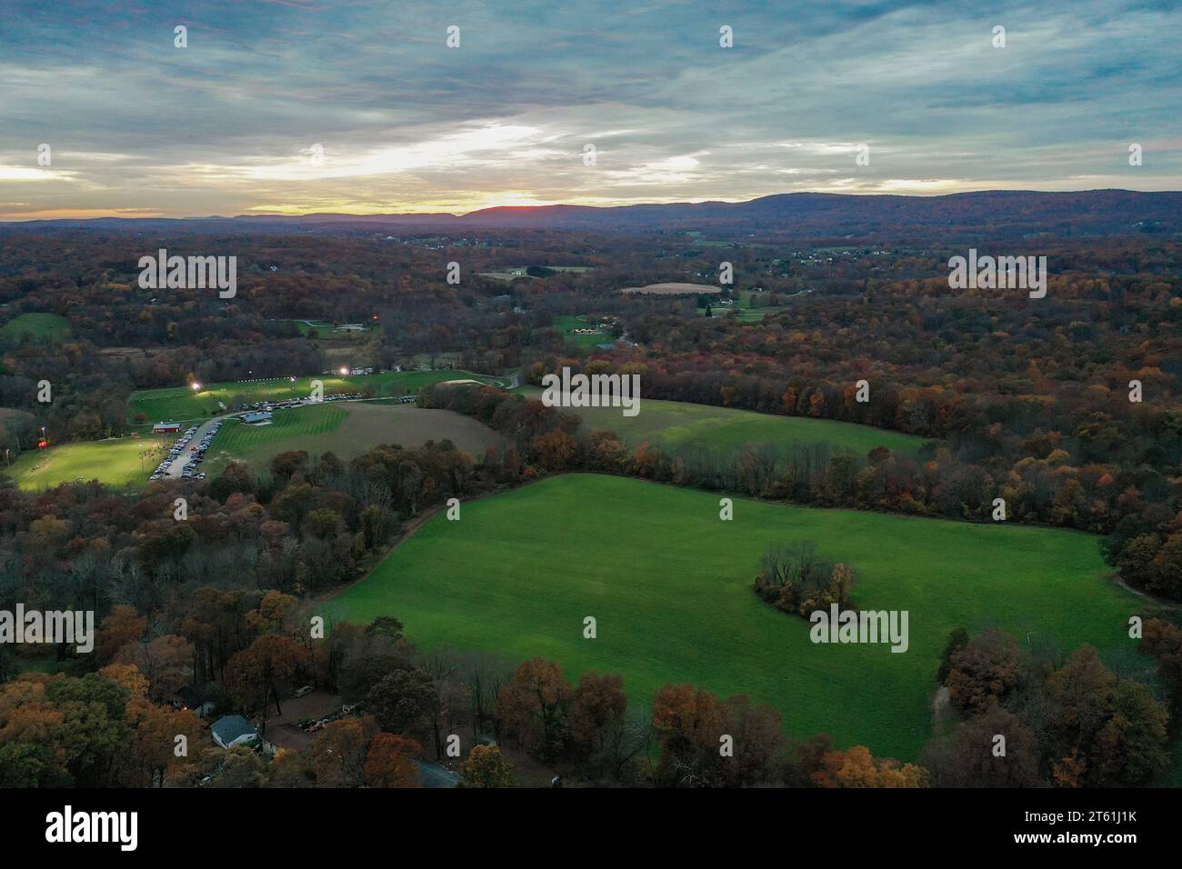 Wantage Township, Sussex County, NJ, Lake Neepaulin,and Kittatinny Mountains with High Point late fall sunset aerial Stock Photo