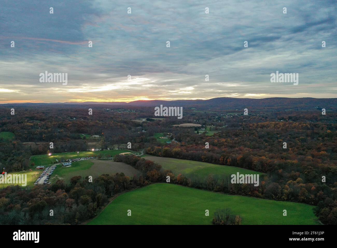 Wantage Township, Sussex County, NJ, Lake Neepaulin,and Kittatinny Mountains with High Point late fall sunset aerial Stock Photo