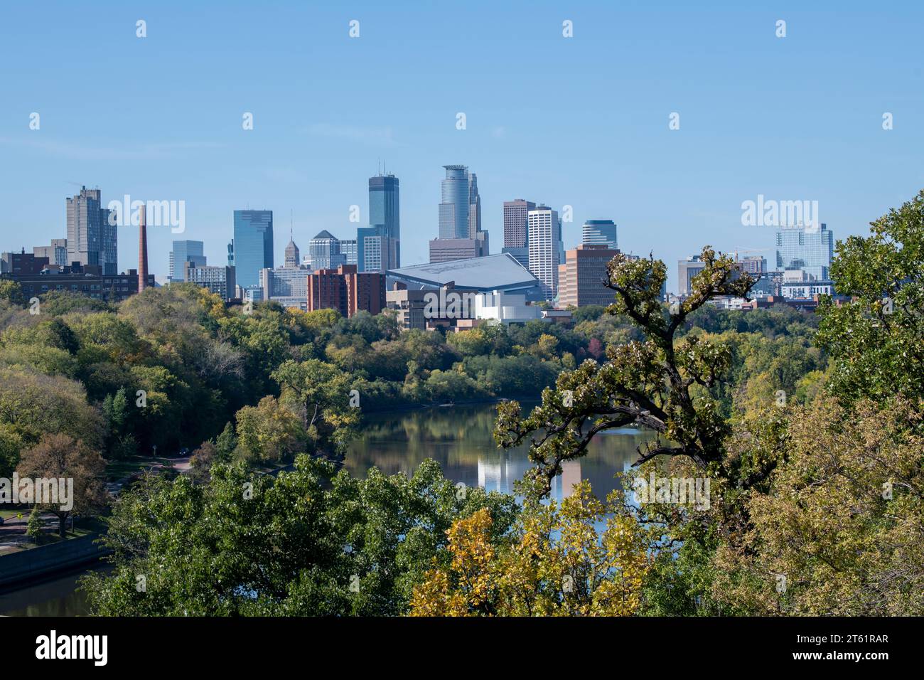 Minneapolis, Minnesota.  Skyline showing the Mississippi river and US Bank Stadium in the fall. Stock Photo