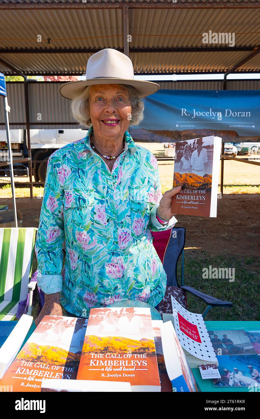 Author Jocelyn Doran selling her biography at the Boulia camel and horse races, a popular Outback event in Queensland, QLD, Australia Stock Photo