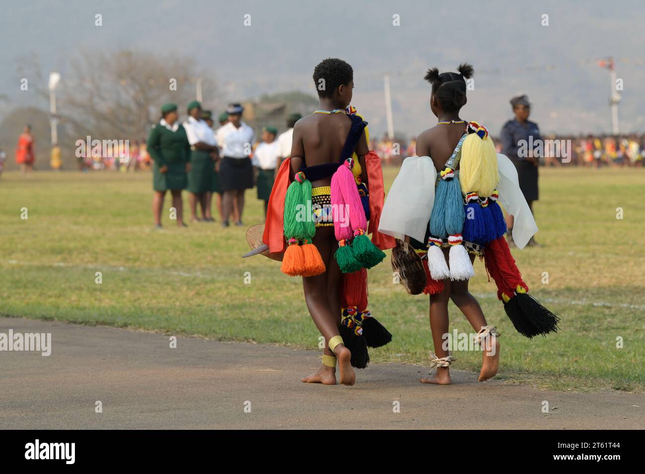 Colourful traditional Swazi dress of two girls at royal Umhlanga reed dance festival 2023, Kingdom of Eswatini, Africa culture event, ethnic costume Stock Photo