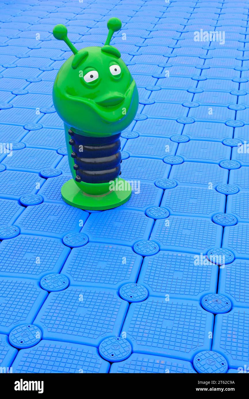 Plastic sculptures of green insects on the buoy deck Stock Photo