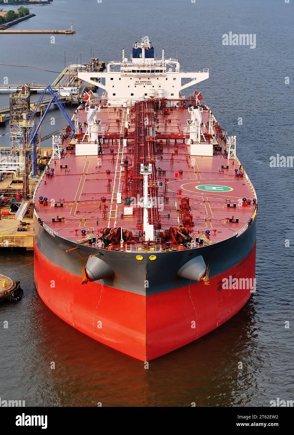 Aerial Closeup View of Oil Tanker Ship in Port at Refinery Stock Photo