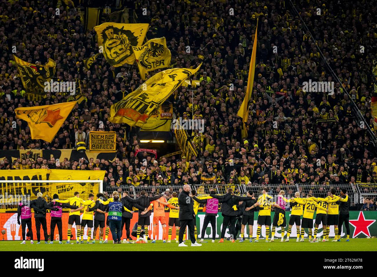DORTMUND, GERMANY - NOVEMBER 7: Nico Schlotterbeck of Borussia Dortmund, Ramy Bensebaini of Borussia Dortmund, Karim Adeyemi of Borussia Dortmund, Julian Brandt of Borussia Dortmund, Niclas Fullkrug of Borussia Dortmund, Gregor Kobel of Borussia Dortmund, Julian Ryerson of Borussia Dortmund, Felix Nmecha of Borussia Dortmund, Niklas Sule of Borussia Dortmund, Marco Reus of Borussia Dortmund, Marcel Sabitzer of Borussia Dortmund, Youssoufa Moukoko of Borussia Dortmund, Mats Hummels of Borussia Dortmund thank their fans for their support after the UEFA Champions League Group F match between Boru Stock Photo