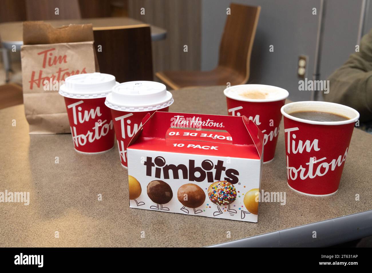 Tim Hortons coffee shop, coffee and food. A canadian cafe restaurant. Coffee cups and Timbits close up; Halifax Nova Scotia Canada. Stock Photo