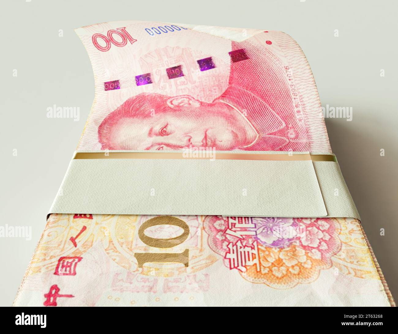 A bundled wad of China Yuan banknotes on an isolated light background - 3D render Stock Photo