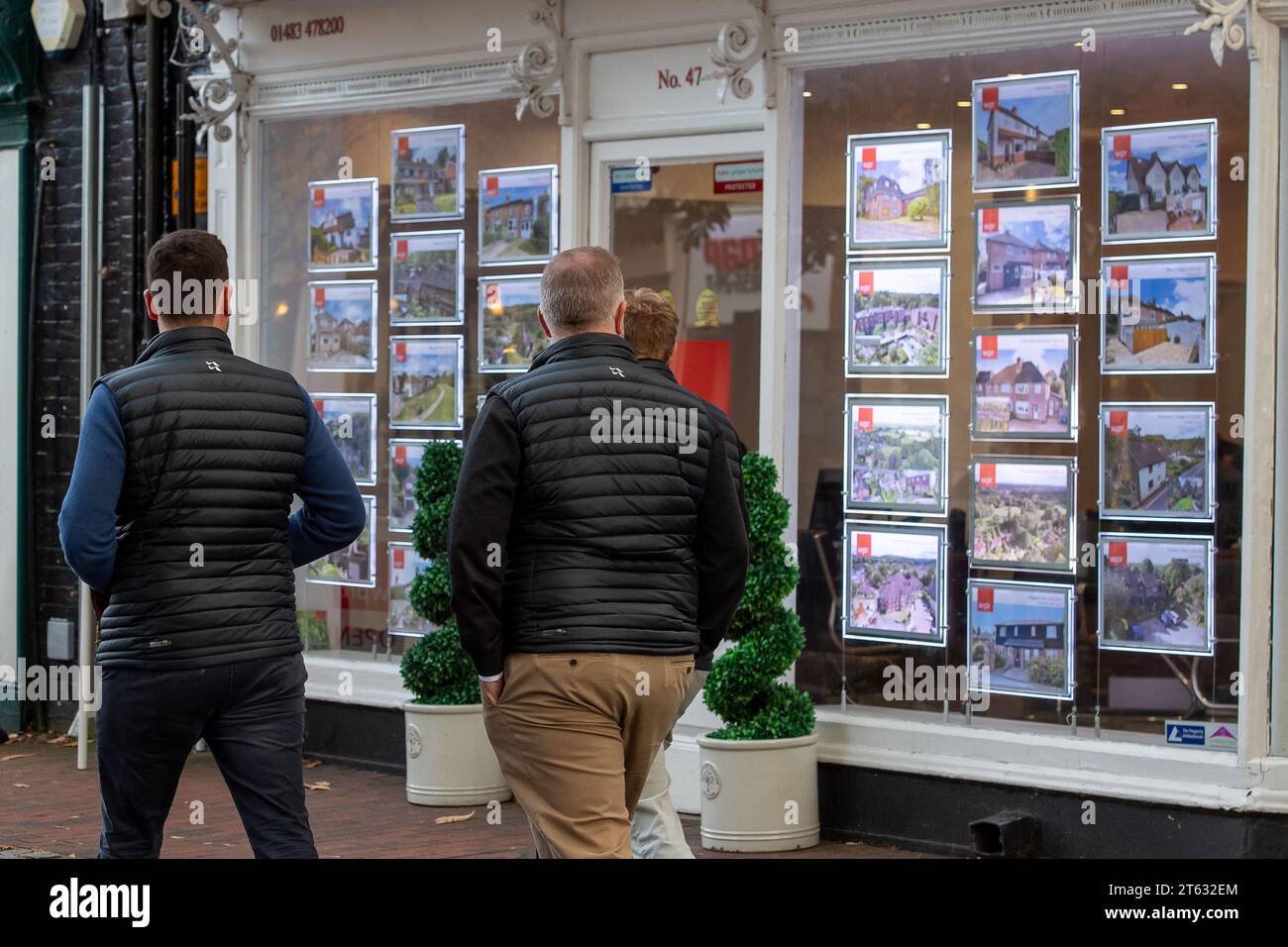 Godalming, Surrey, UK. 7th November, 2023. People walk past an Estate