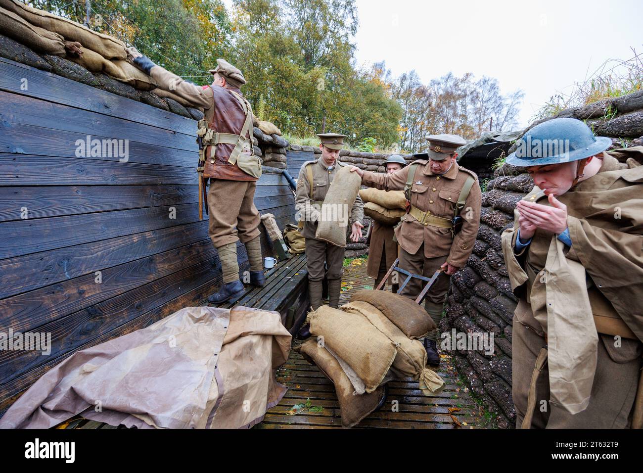 The Staffordshire Regiment Museum have built Trenches modelled on the real ones used in World War to give visitors an experience of what life was like for soldiers in the trenches. The museum holds events using reenactors to create the mood and bring to life history from the period. Pictured, reenactors adding sandbags to the trenches. Stock Photo