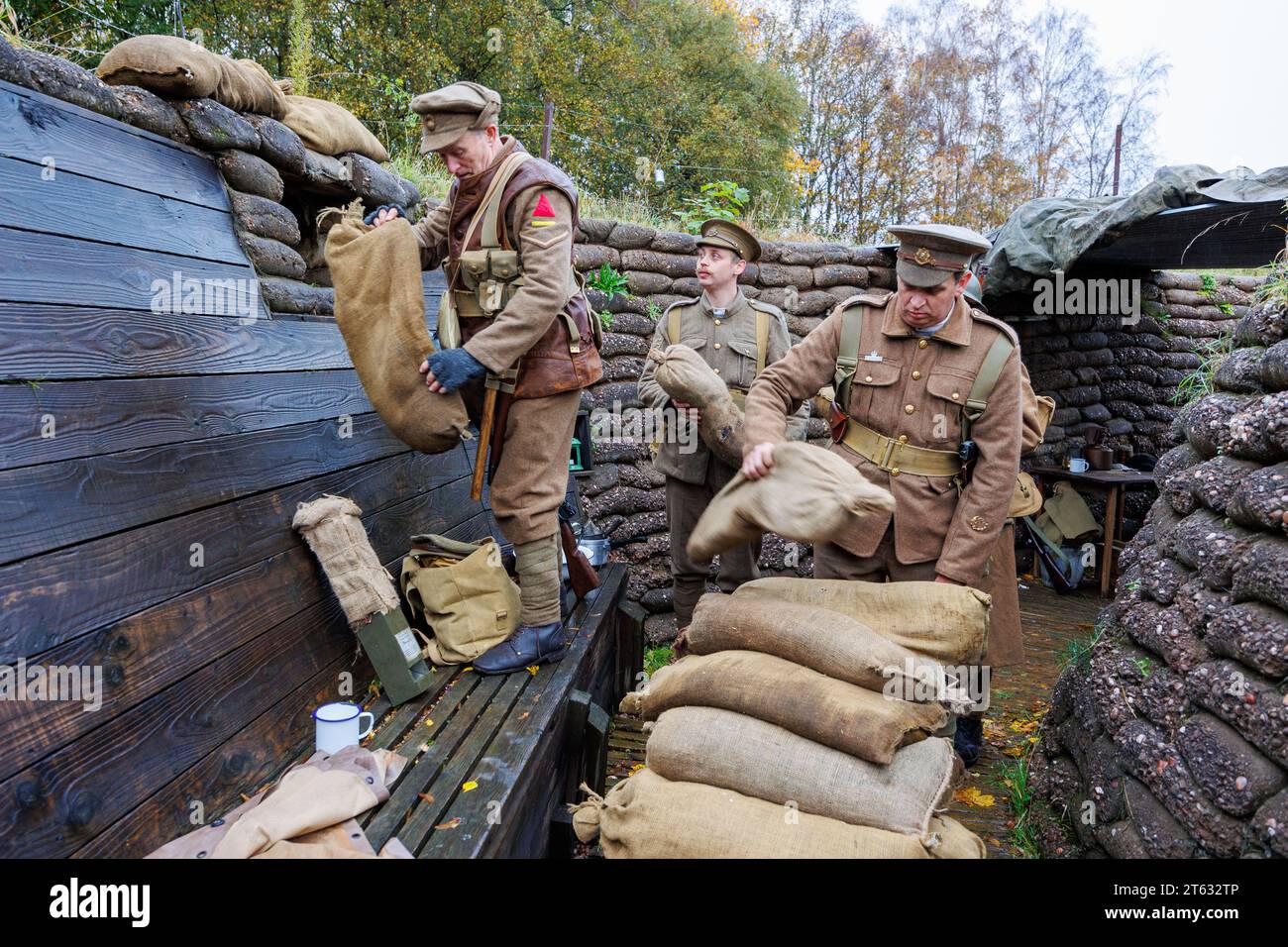 The Staffordshire Regiment Museum have built Trenches modelled on the real ones used in World War to give visitors an experience of what life was like for soldiers in the trenches. The museum holds events using reenactors to create the mood and bring to life history from the period. Pictured, reenactors adding sandbags to the trenches. Stock Photo