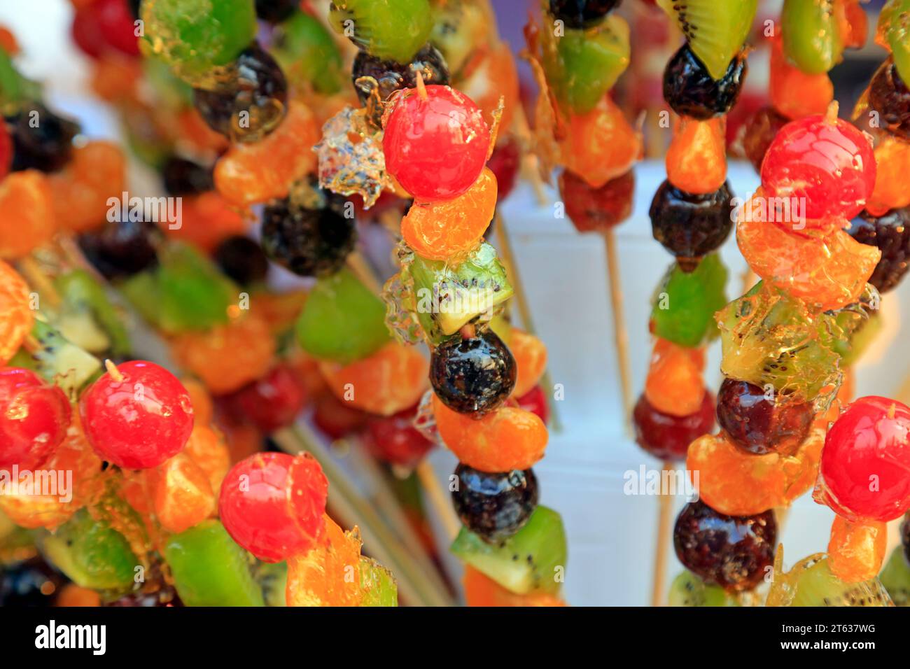 Bingtanghulu Crispy SugarCoated Fruit on a Stick Stock Photo Alamy