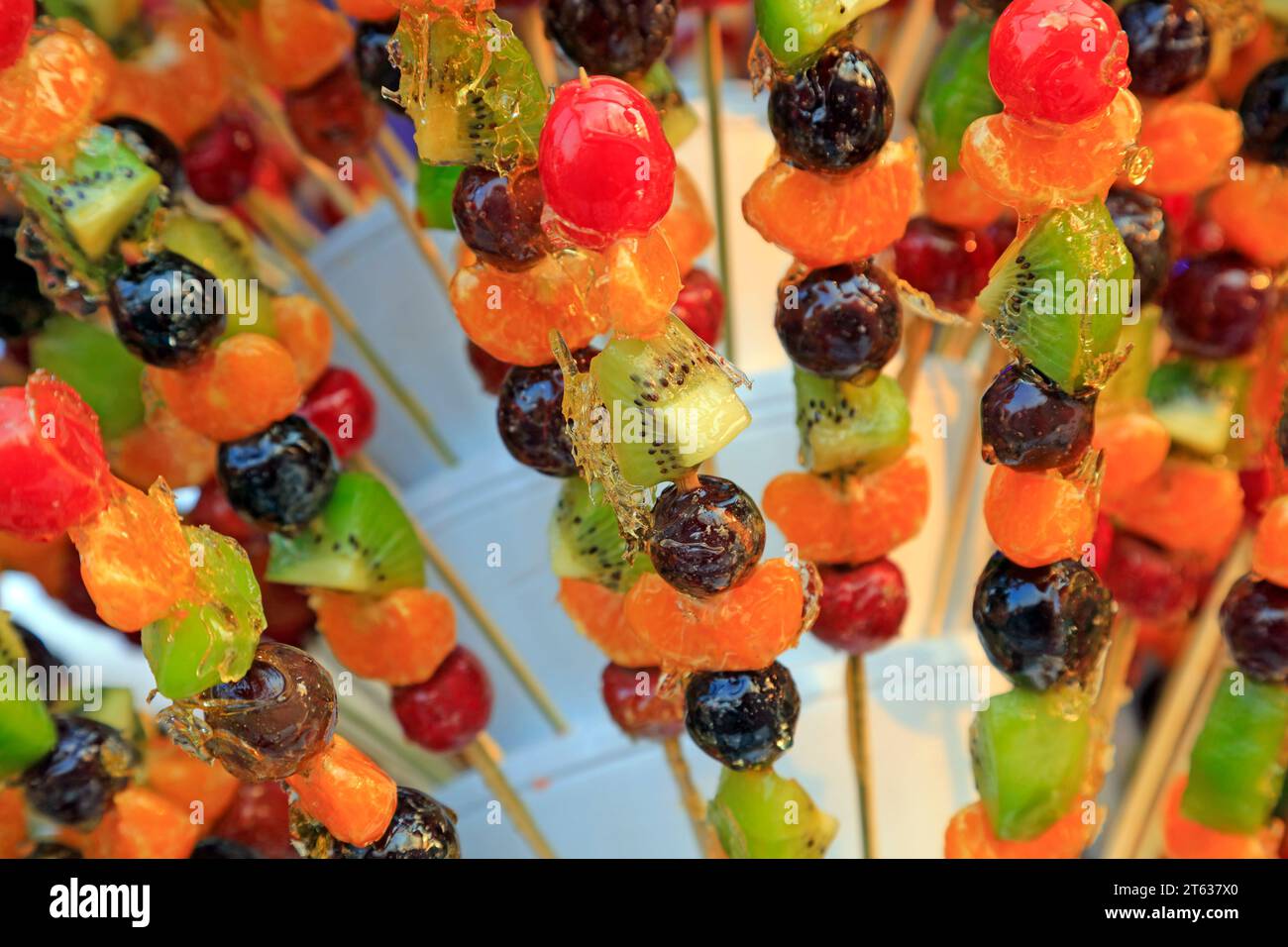 Bingtanghulu Crispy SugarCoated Fruit on a Stick Stock Photo Alamy