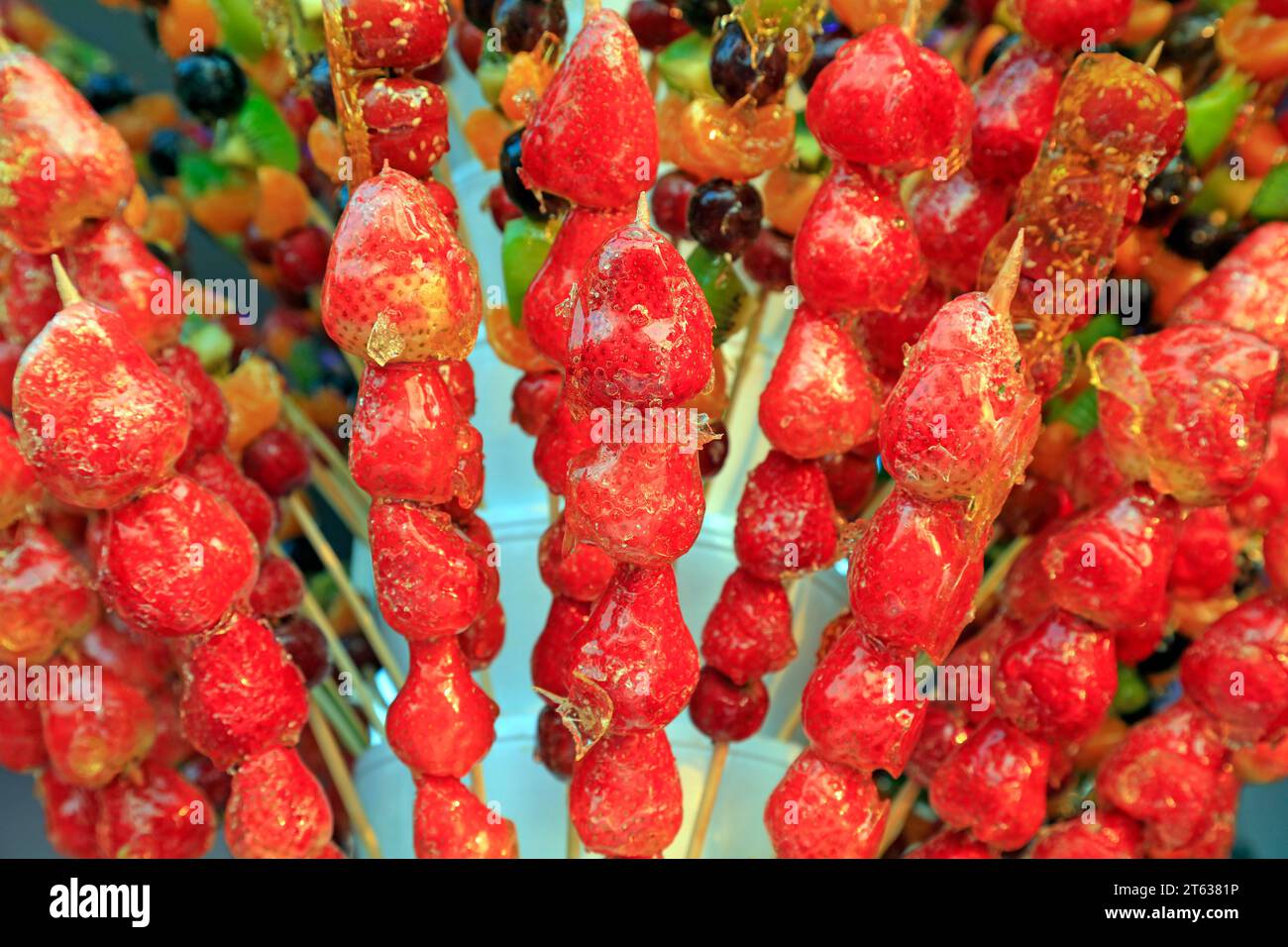 Bingtanghulu Crispy SugarCoated Fruit on a Stick Stock Photo Alamy