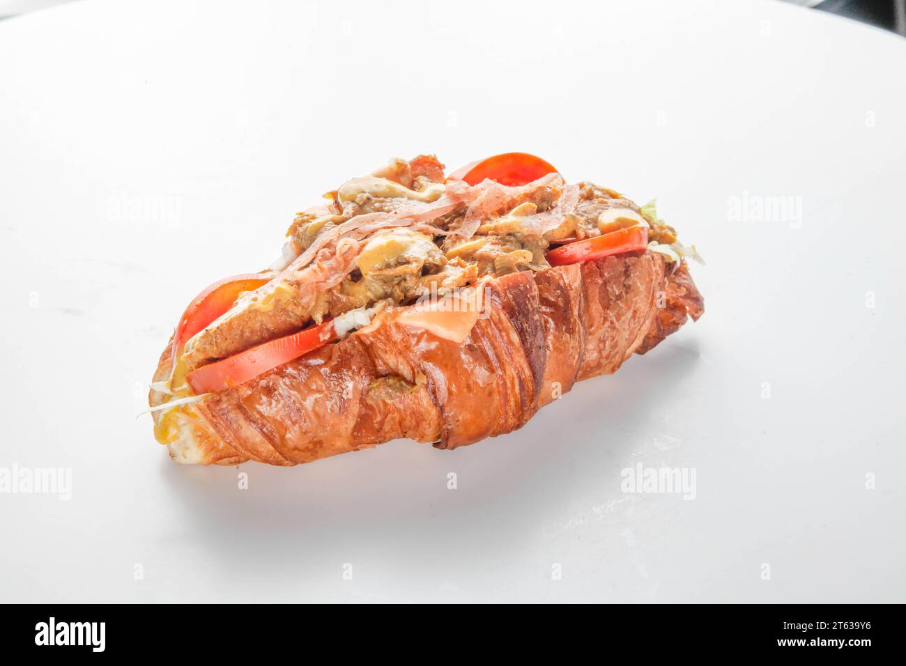 Spicy asian croissant chicken sandwich Stock Photo